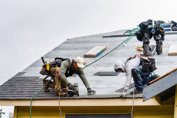 Professional Roofing technician working in Enosburg Falls, VT